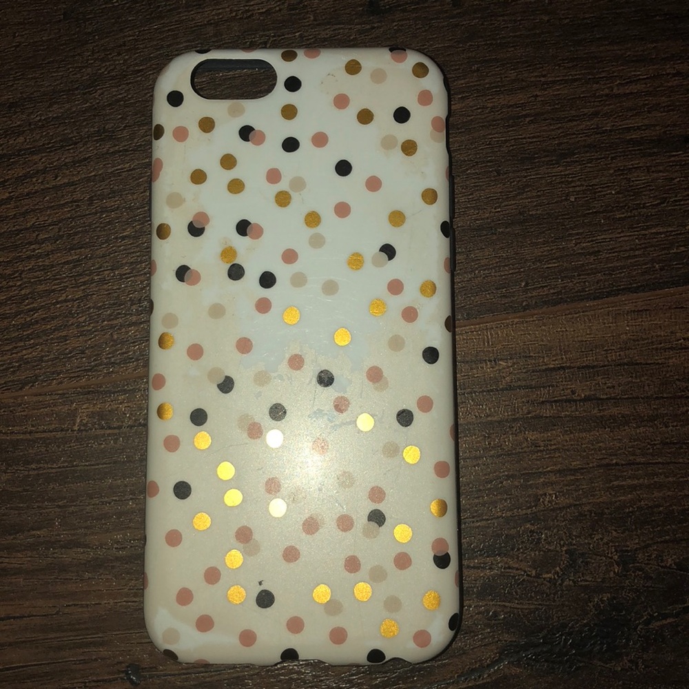 white case. with gold and black polka dots
